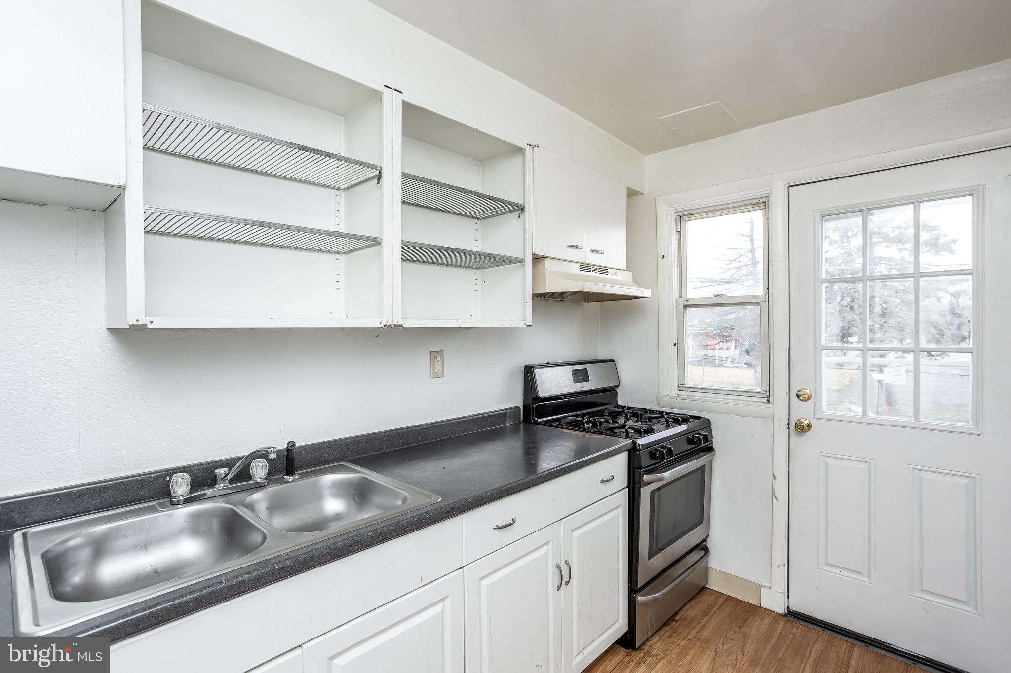 728 Aldworth Road Baltimore, MD 21222 - Photo 6 of 21 a kitchen with appliances a sink and cabinets