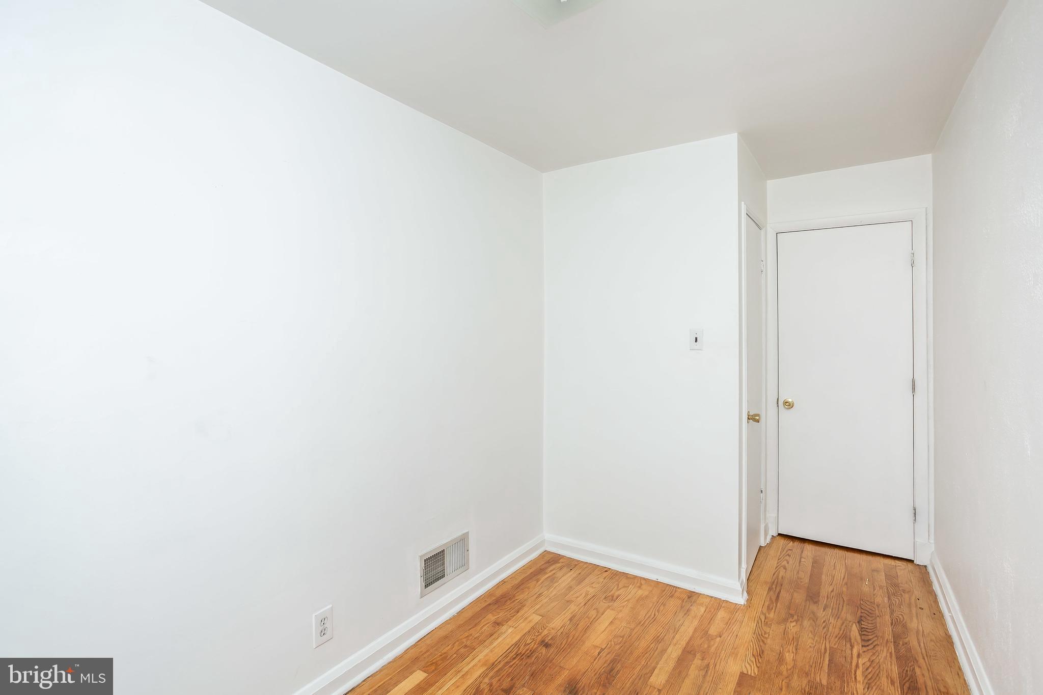 728 Aldworth Road Baltimore, MD 21222 - Photo 9 of 21 a view of a small space with wooden floor