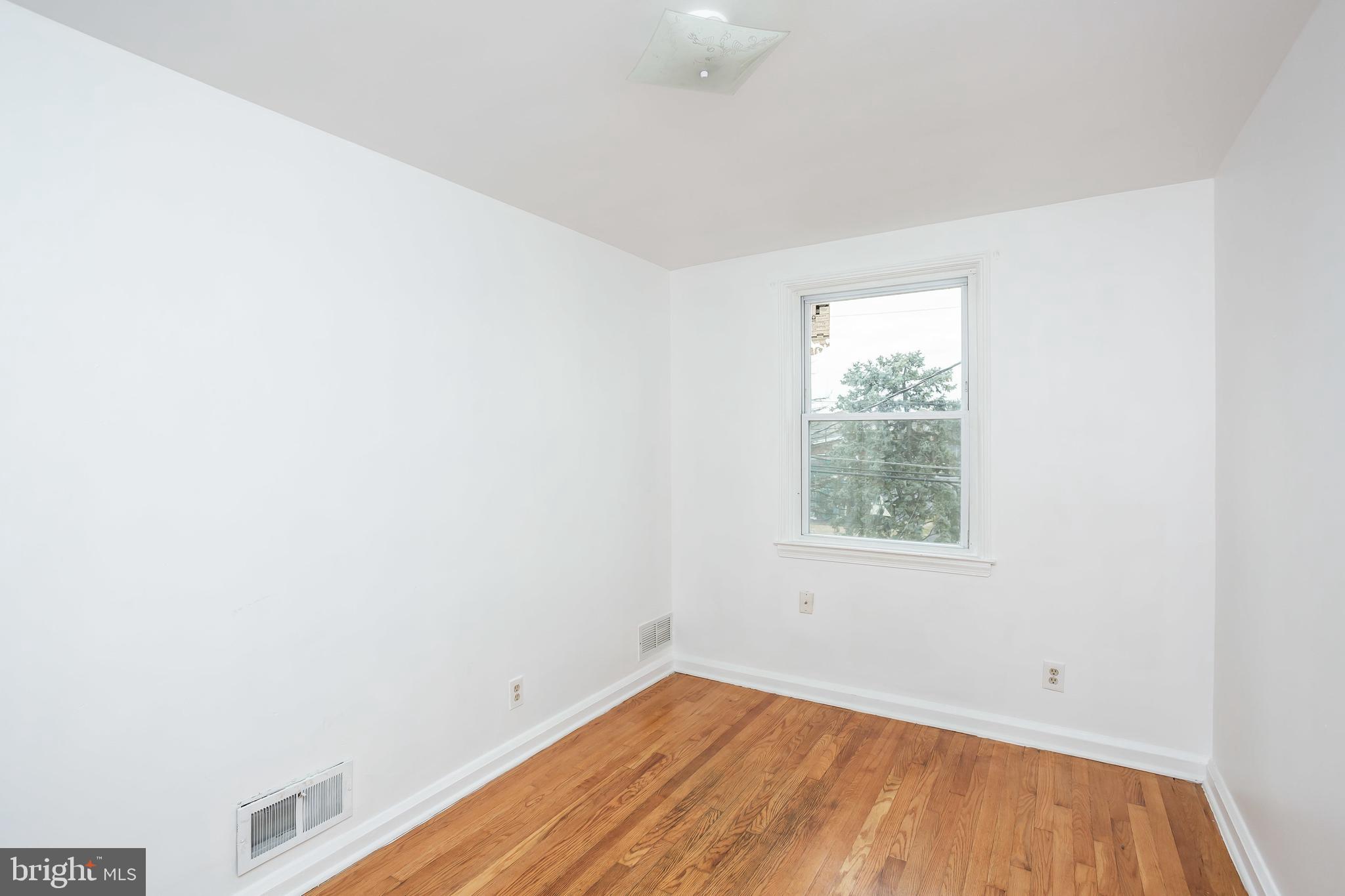 728 Aldworth Road Baltimore, MD 21222 - Photo 10 of 21 an empty room with a window