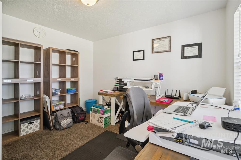 12656 Brun Street Caldwell, ID 83607 - Photo 11 of 39 Office featuring dark colored carpet and a textured ceiling