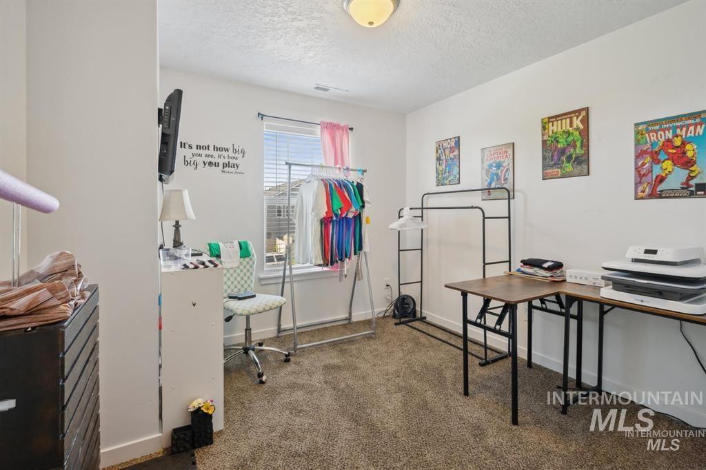 12656 Brun Street Caldwell, ID 83607 - Photo 16 of 39 Office featuring dark colored carpet and a textured ceiling