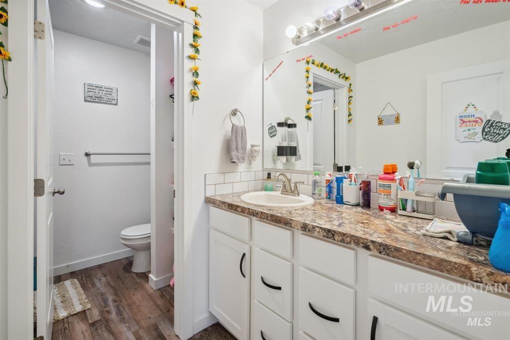 12656 Brun Street Caldwell, ID 83607 - Photo 20 of 39 Bathroom with vanity and dark wood-style floors