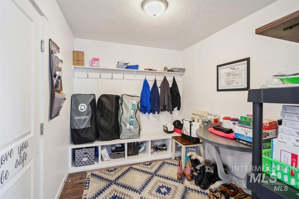 12656 Brun Street Caldwell, ID 83607 - Photo 27 of 39 Mudroom with a textured ceiling and wood finished floors