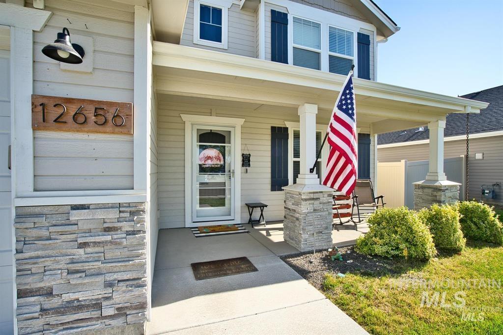 12656 Brun Street Caldwell, ID 83607 - Photo 5 of 39 Doorway to property with a porch and stone siding