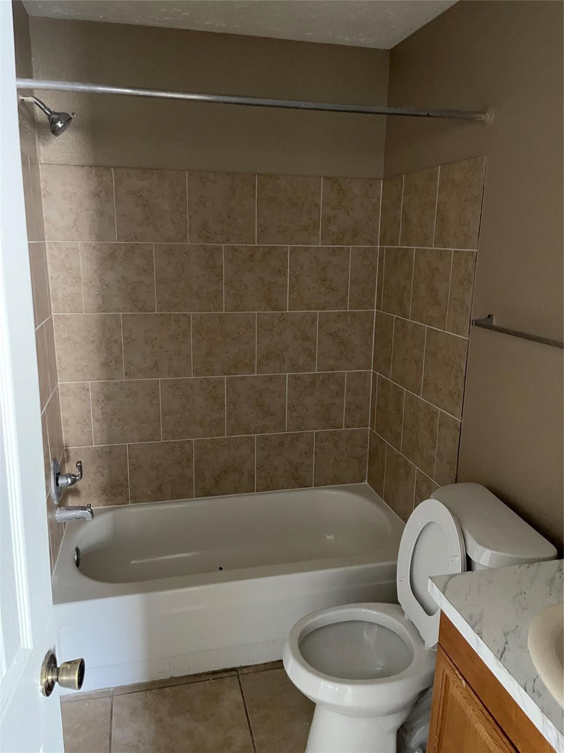 4923 Hickorygate Drive Spring, TX 77373 - Photo 4 of 7 a white bath tub sitting next to a toilet