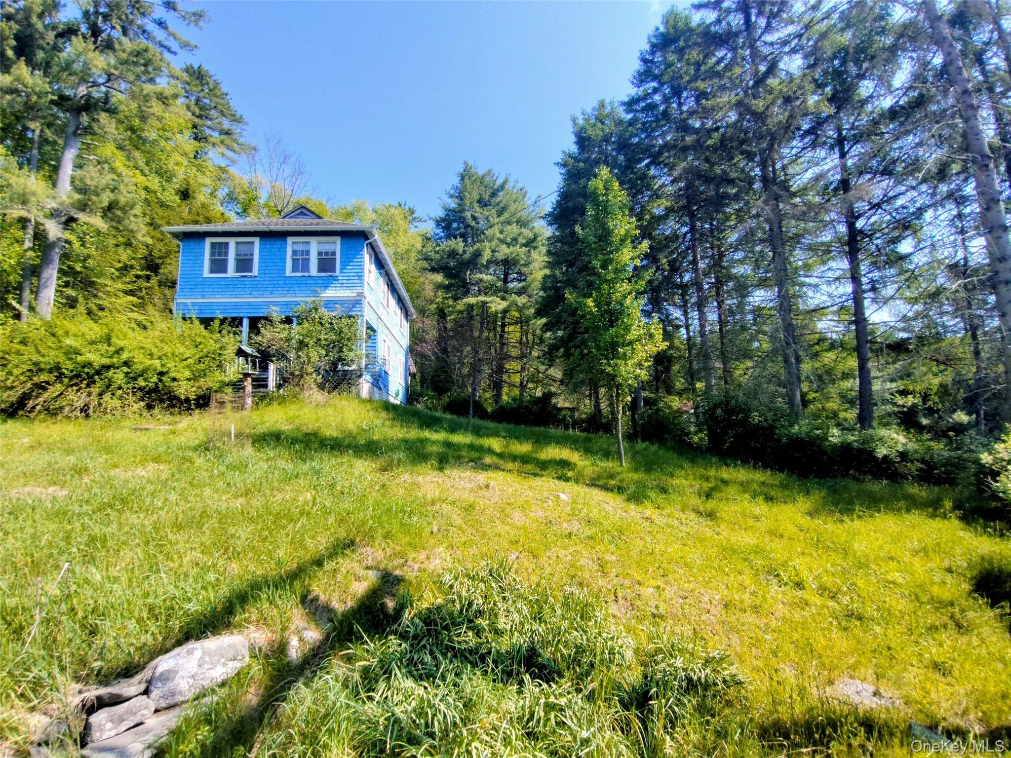 174 Forestburgh Road Forestburgh, NY 12777 - Photo 13 of 28 a view of a house with a yard
