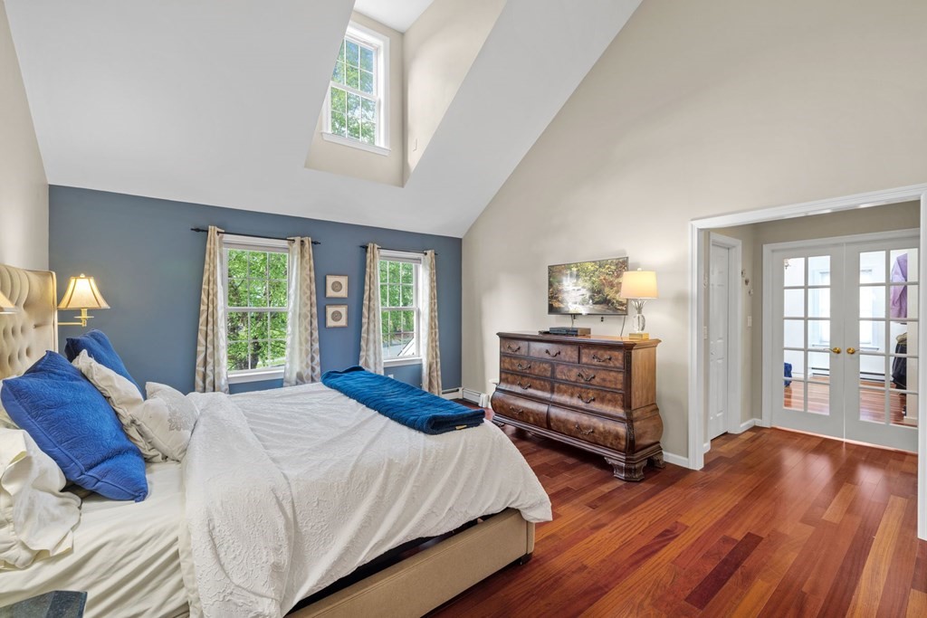 17 Amherst Road Shrewsbury, MA 01545 - Photo 21 of 42 a bedroom with a bed and wooden floor