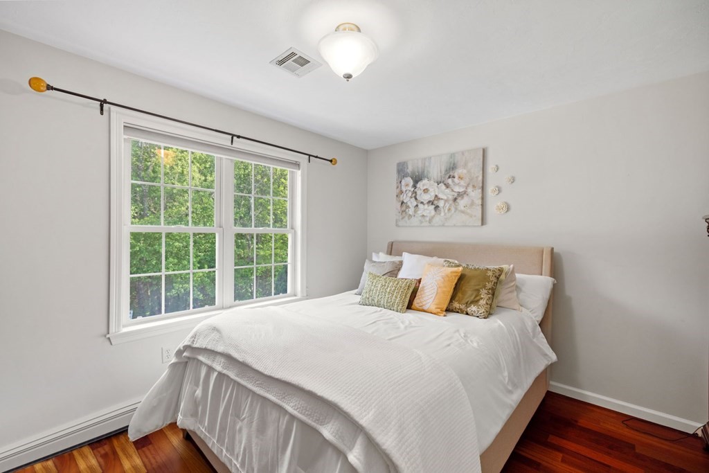 17 Amherst Road Shrewsbury, MA 01545 - Photo 26 of 42 a bedroom with a large bed and a window