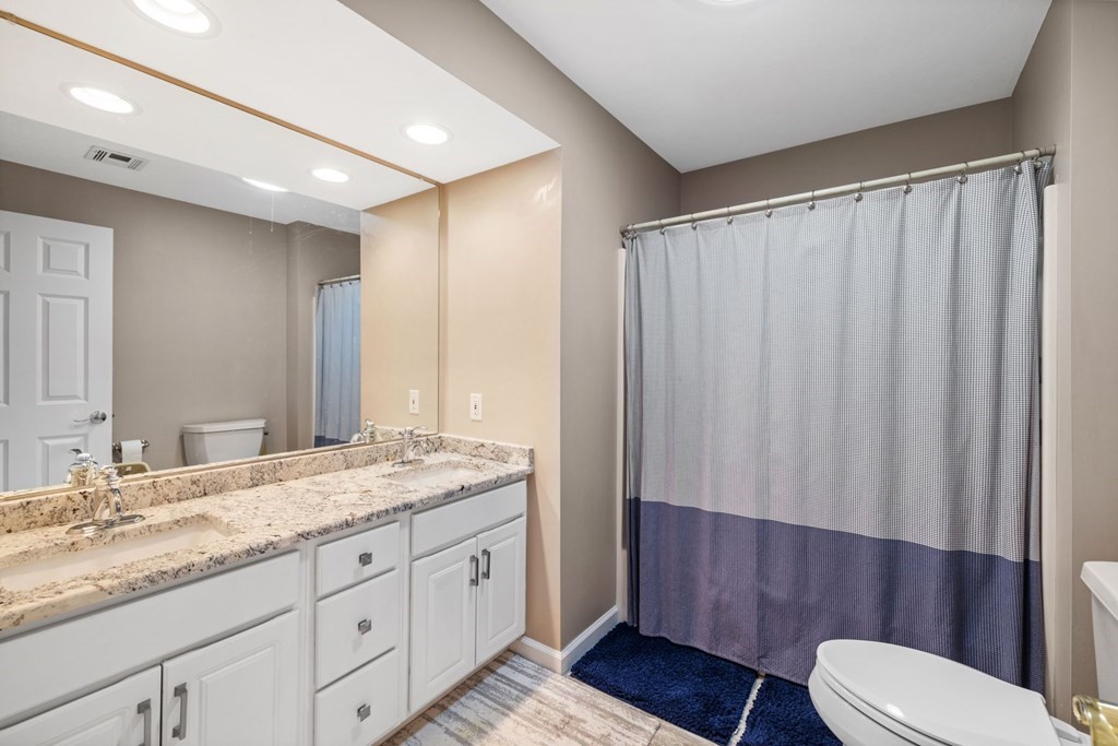 17 Amherst Road Shrewsbury, MA 01545 - Photo 27 of 42 a bathroom with a granite countertop sink toilet and shower