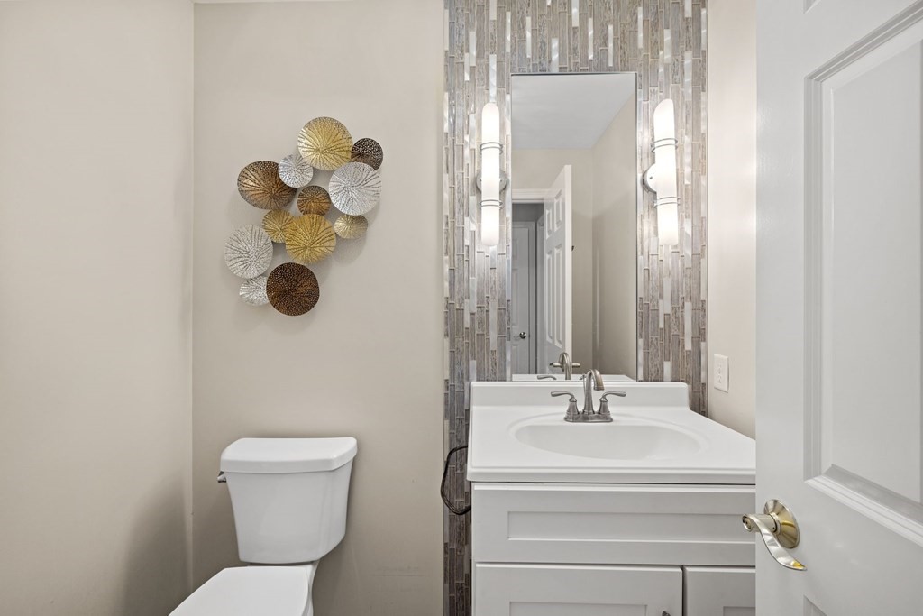 17 Amherst Road Shrewsbury, MA 01545 - Photo 9 of 42 a bathroom with a sink mirror and toilet