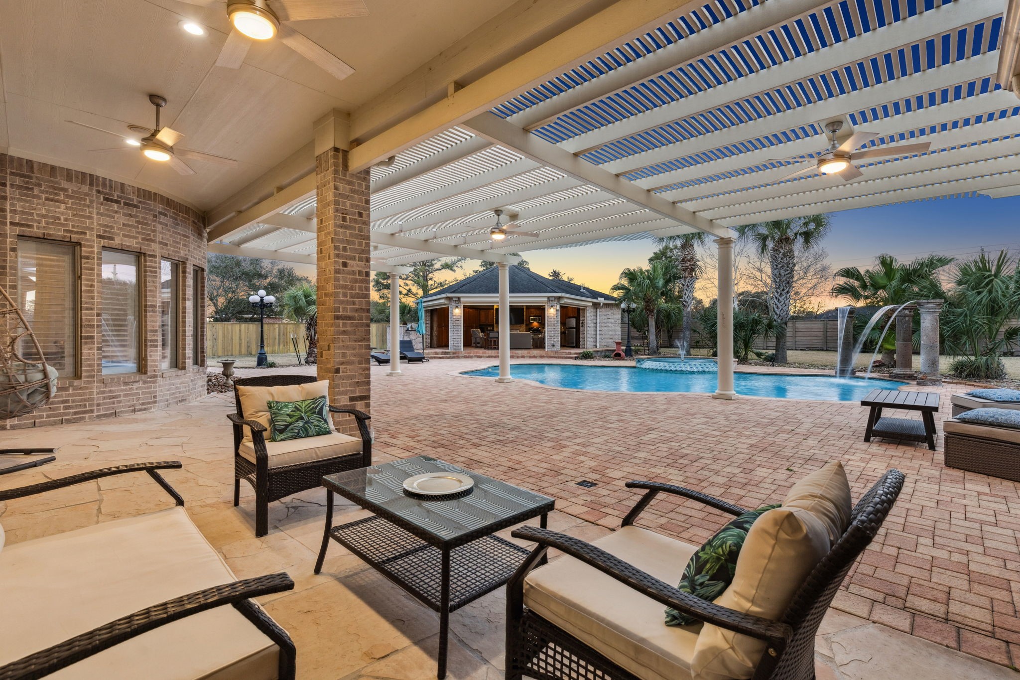 2202 Britton Ridge Drive Katy, TX 77494 - Photo 25 of 41 The extended covered patio offers plenty of space for a lounge setup or outdoor dining, creating a versatile area to enjoy the backyard.