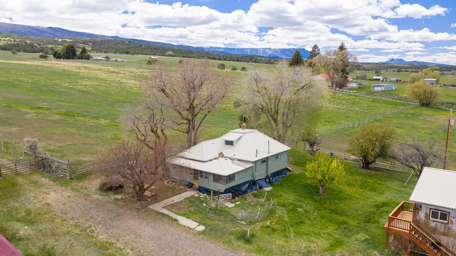 11260 54 7/10 Road Molina, CO 81646 - Photo 4 of 31 a view of a lake with a yard