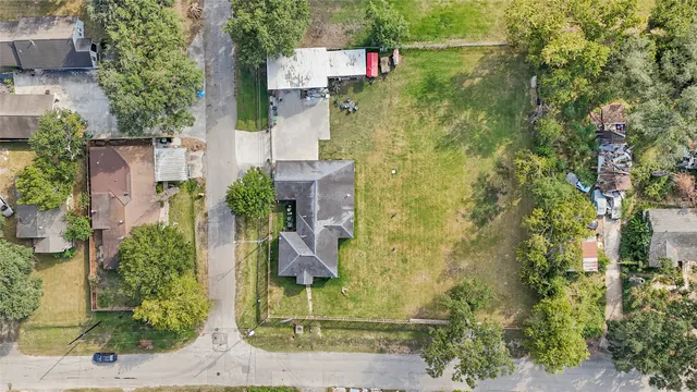 an aerial view of residential house with outdoor space