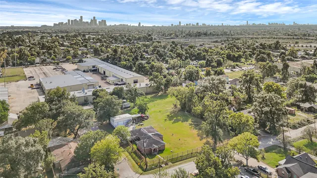 an aerial view of residential house with outdoor space and swimming pool