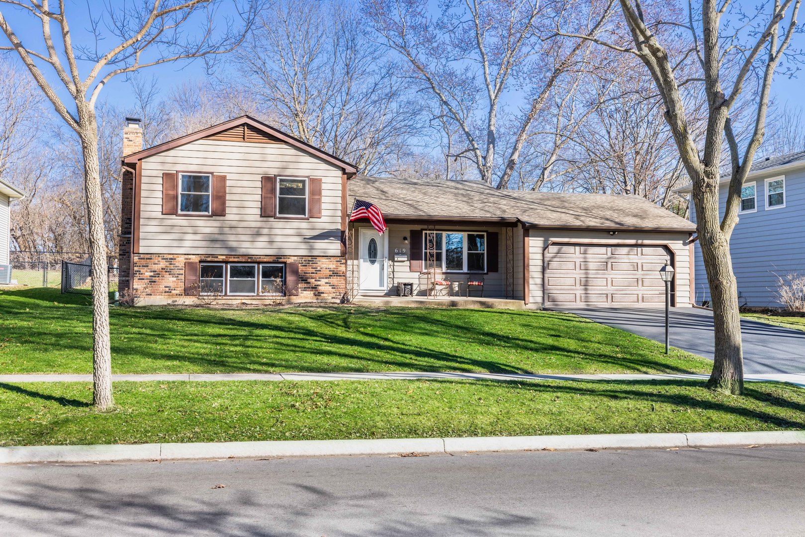 a front view of a house with a yard