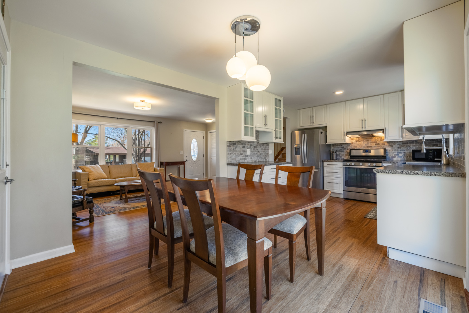 619 Scott Street Algonquin, IL 60102 - Photo 12 of 48 a view of a dining room with furniture and wooden floor
