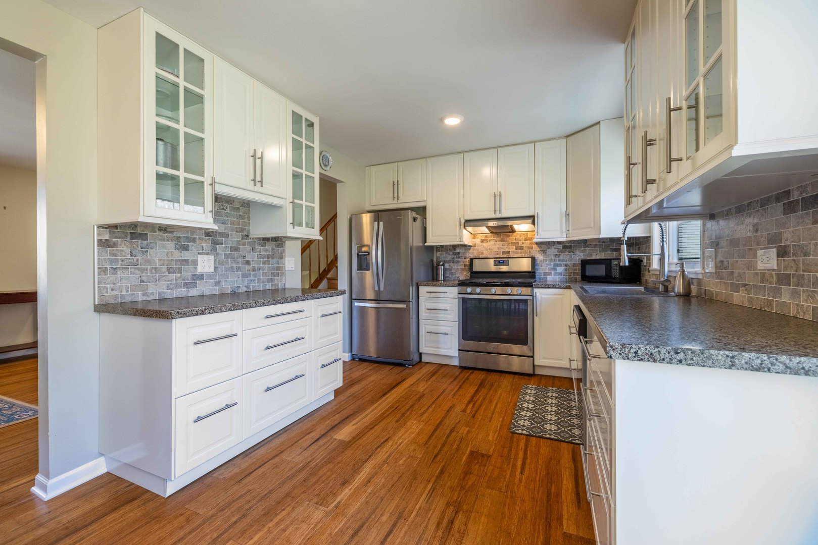 619 Scott Street Algonquin, IL 60102 - Photo 14 of 48 a kitchen with stainless steel appliances granite countertop a stove a sink and a refrigerator