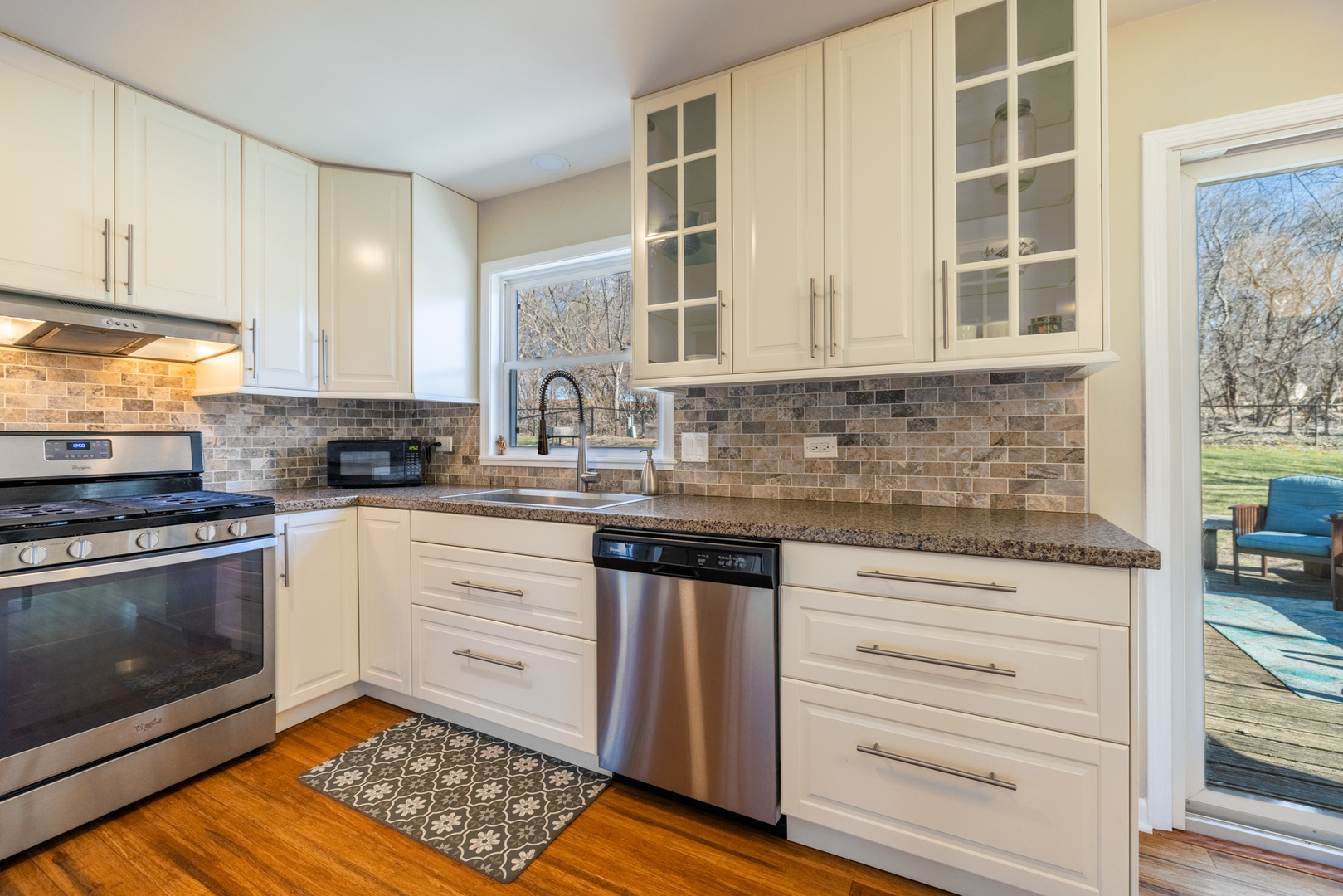 619 Scott Street Algonquin, IL 60102 - Photo 15 of 48 a kitchen with stainless steel appliances granite countertop a stove and cabinets