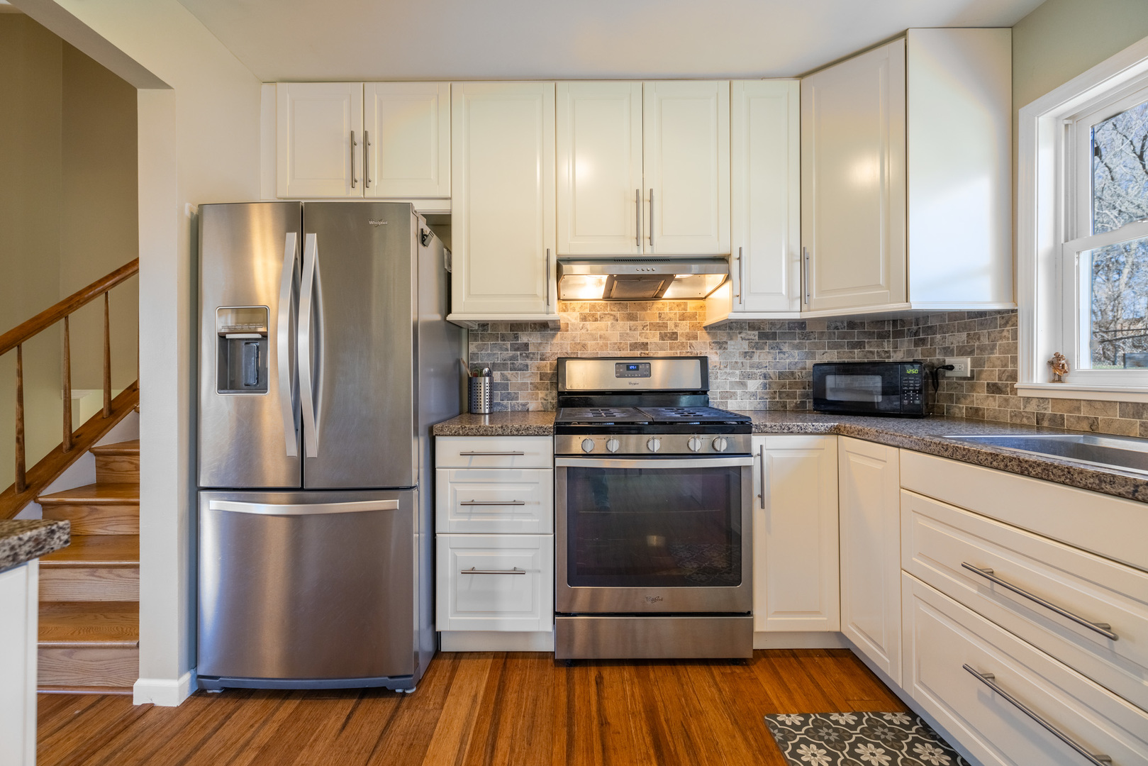 619 Scott Street Algonquin, IL 60102 - Photo 16 of 48 a kitchen with a refrigerator stove and wooden cabinets