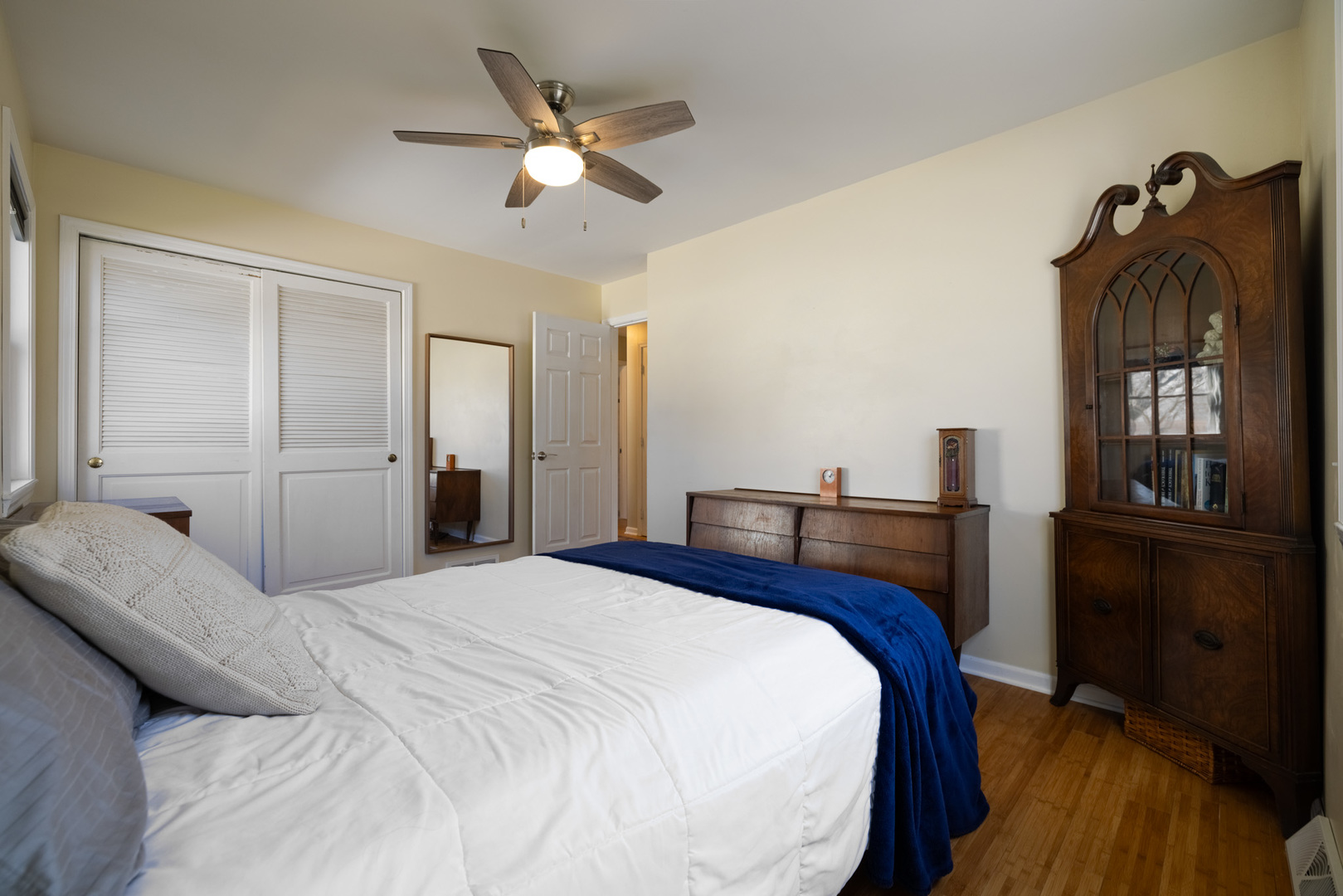 619 Scott Street Algonquin, IL 60102 - Photo 20 of 48 a bedroom with a bed and a chandelier