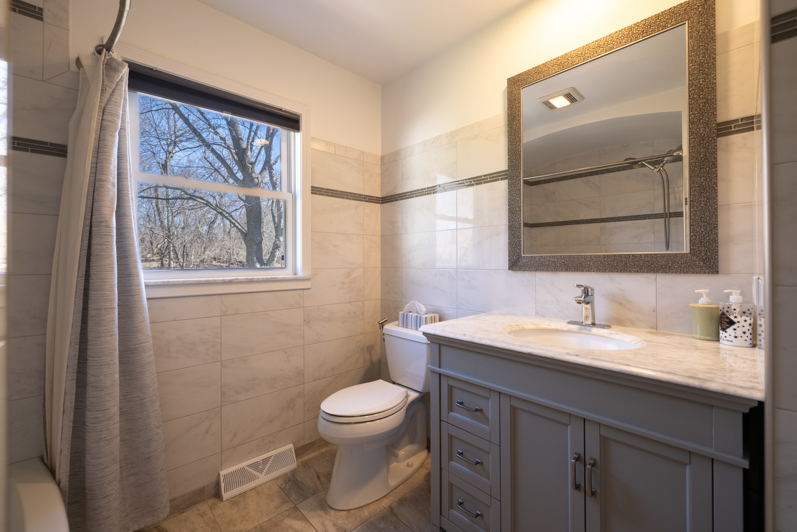 619 Scott Street Algonquin, IL 60102 - Photo 25 of 48 a bathroom with a toilet sink and mirror