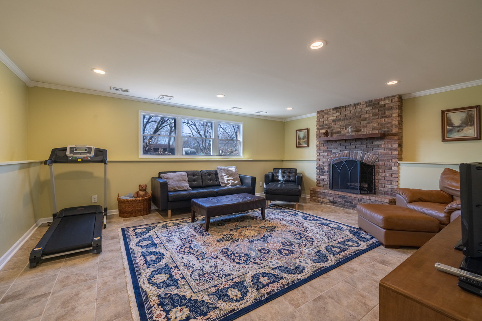 619 Scott Street Algonquin, IL 60102 - Photo 30 of 48 a living room with furniture a rug and a fireplace