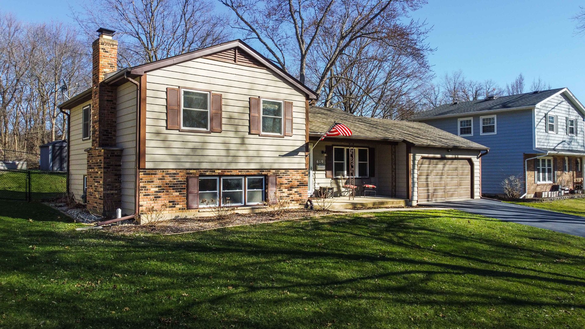 619 Scott Street Algonquin, IL 60102 - Photo 3 of 48 a front view of a house with a yard table and chairs