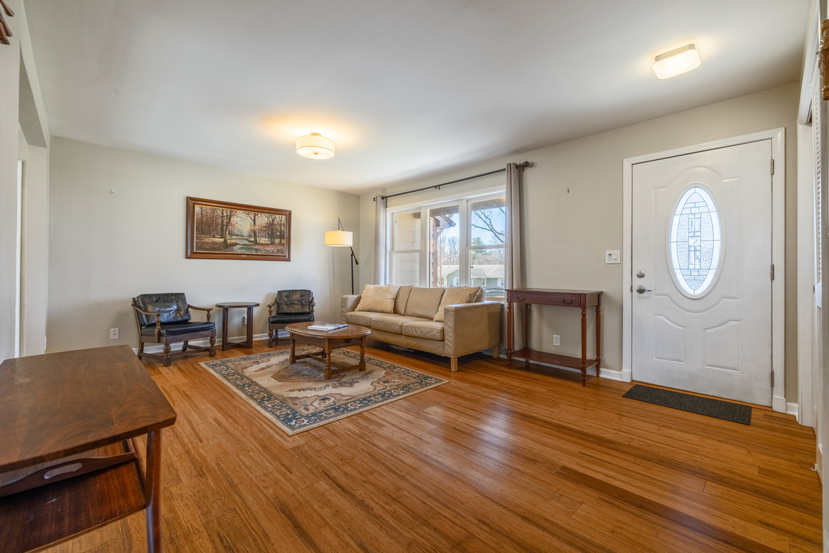 619 Scott Street Algonquin, IL 60102 - Photo 8 of 48 a living room with furniture a large window and wooden floor