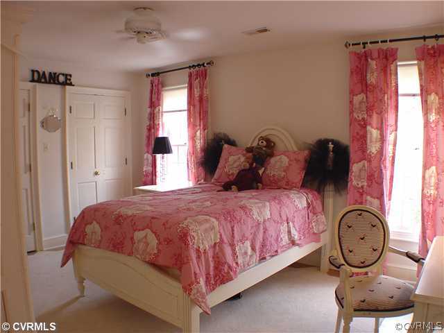 6710 Greenyard Road Chester, VA 23831 - Photo 8 of 12 a bedroom with a bed and a window