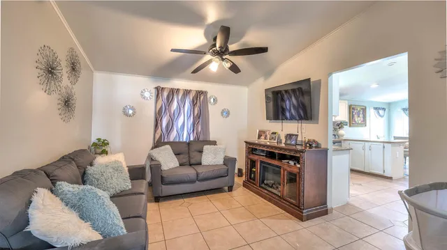 a living room with furniture and a painting