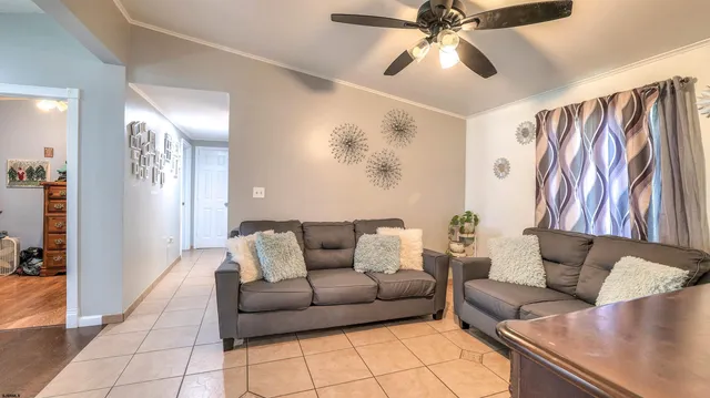 a living room with furniture and a table
