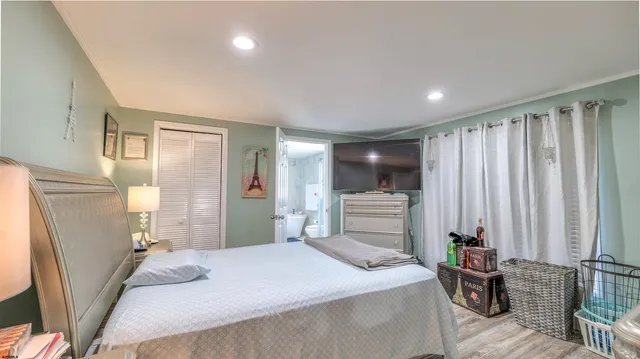 a bedroom with a bed and a closet