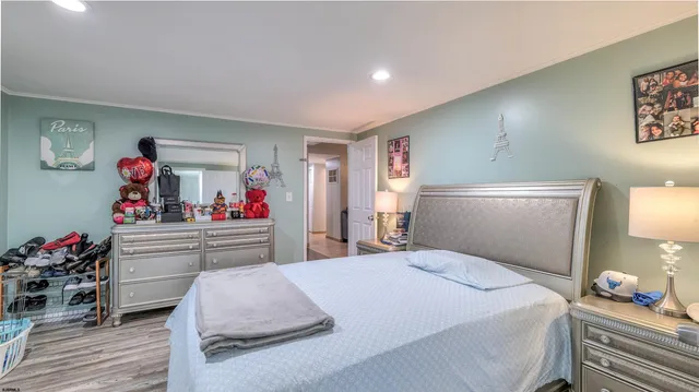 a bathroom with a granite countertop toilet a sink and a mirror