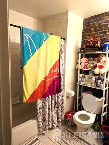 a bathroom with a toilet and a sink