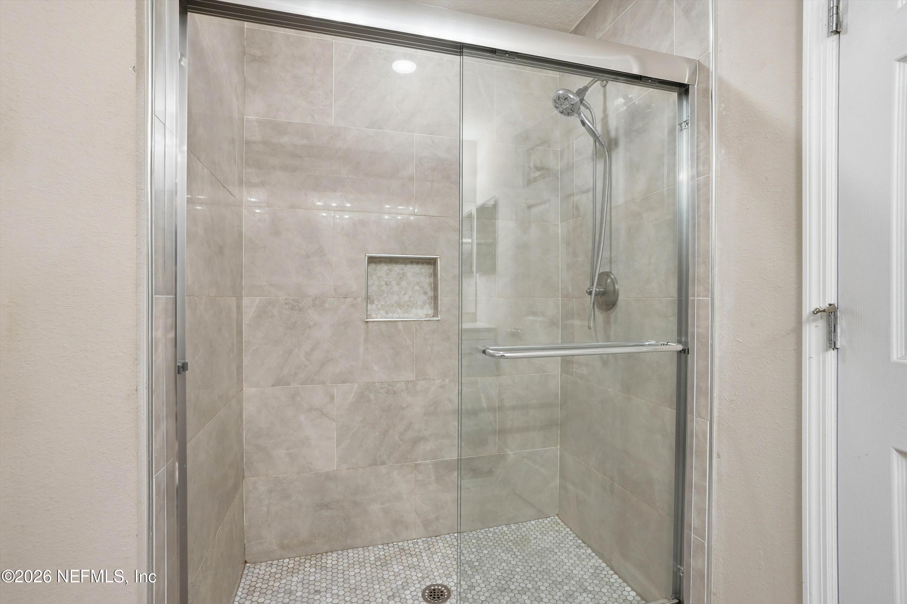29 Auburn Oaks Road West Jacksonville, FL 32218 - Photo 14 of 38 a bathroom with a glass shower door
