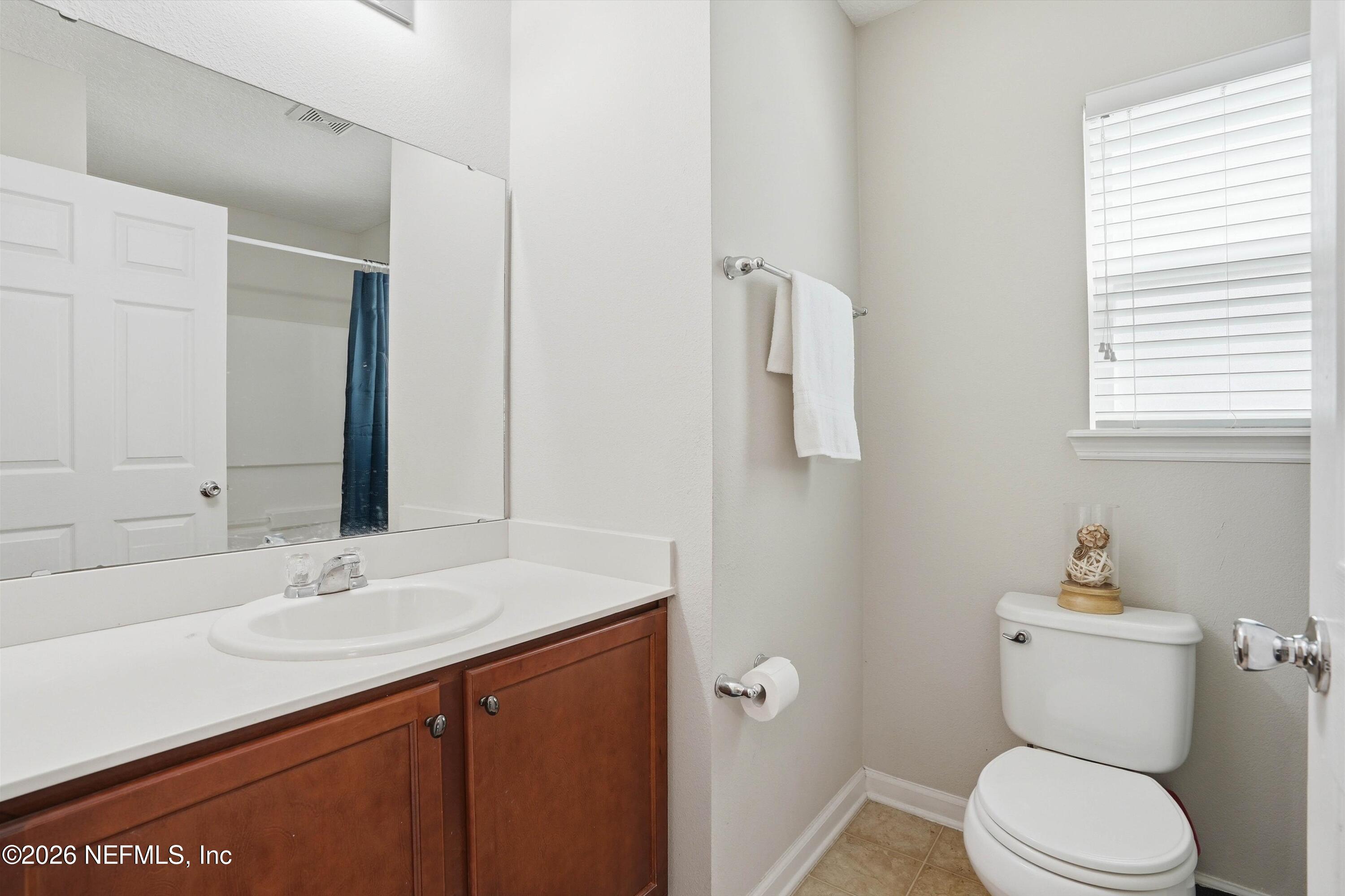 29 Auburn Oaks Road West Jacksonville, FL 32218 - Photo 18 of 38 a bathroom with a sink toilet and vanity