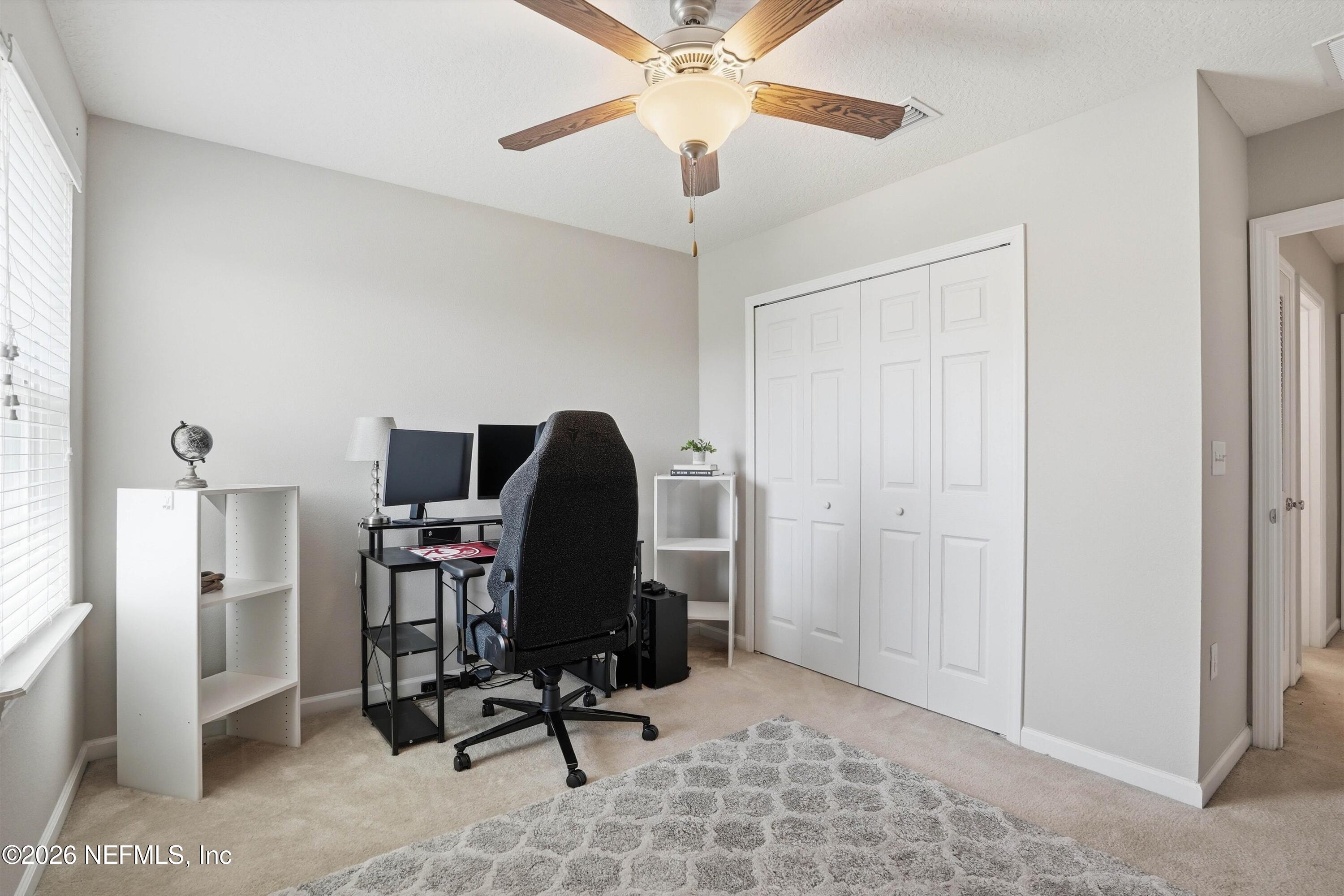 29 Auburn Oaks Road West Jacksonville, FL 32218 - Photo 23 of 38 a view of a workspace with furniture and a window
