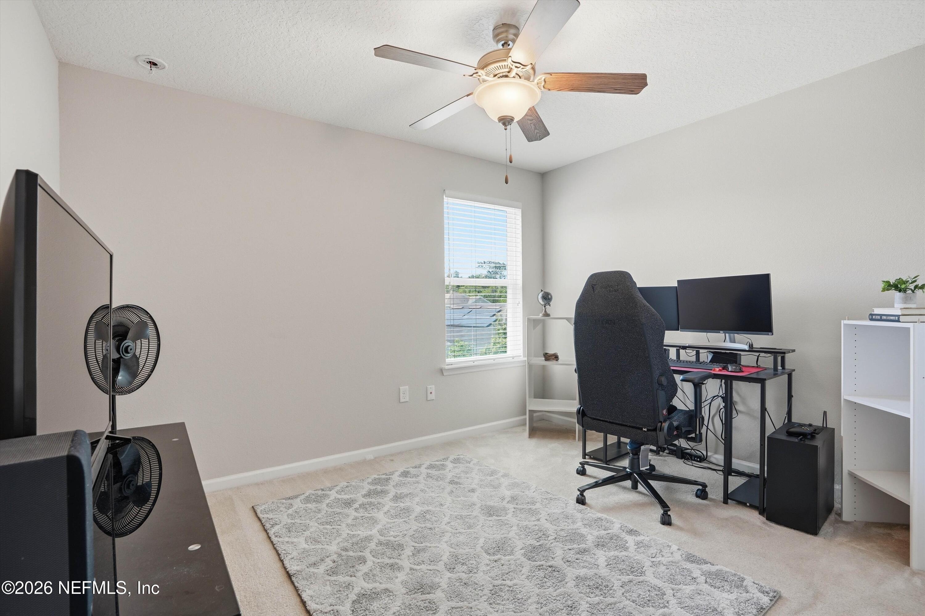 29 Auburn Oaks Road West Jacksonville, FL 32218 - Photo 24 of 38 a view of a workspace with furniture and a window
