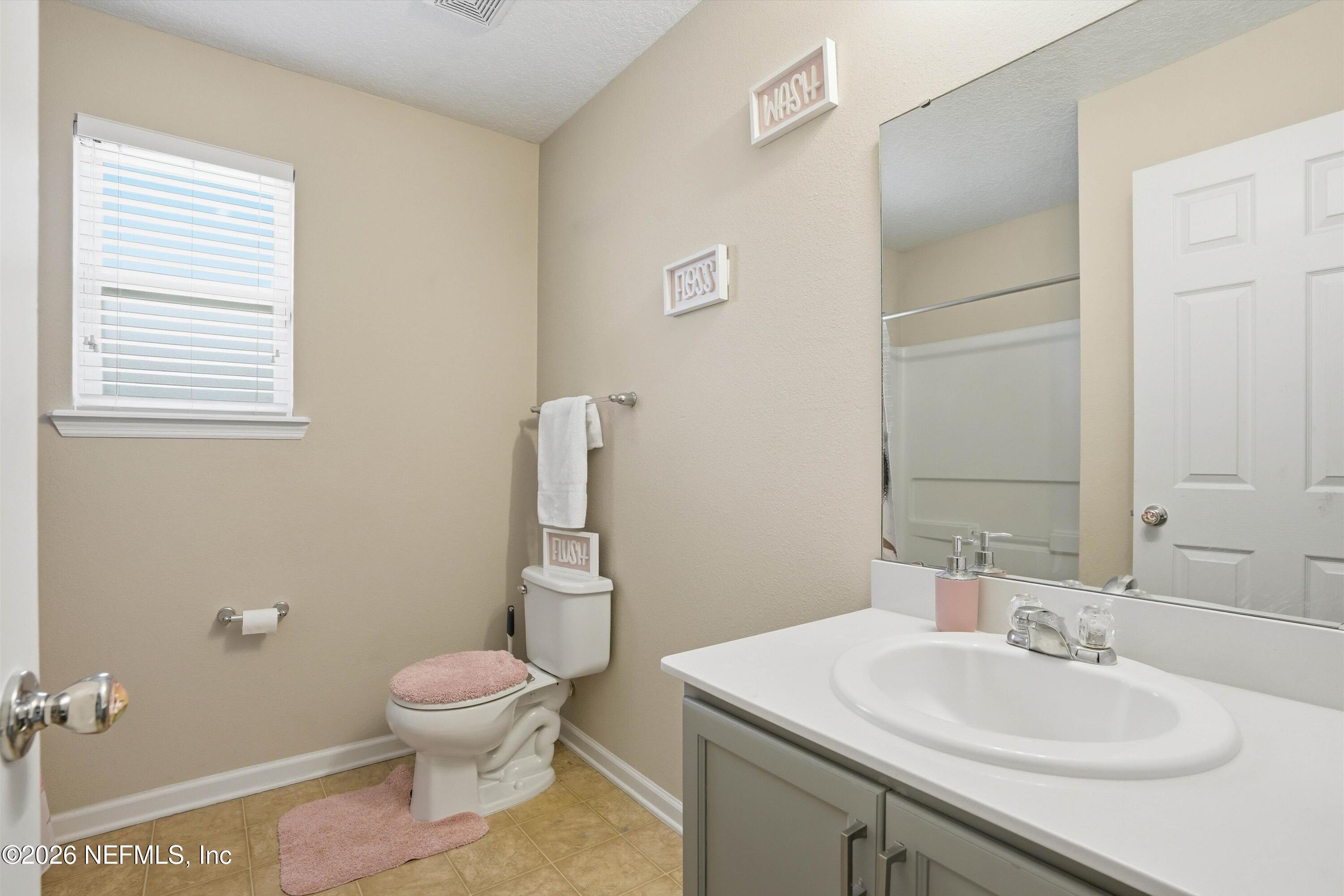 29 Auburn Oaks Road West Jacksonville, FL 32218 - Photo 25 of 38 a bathroom with a sink toilet and mirror