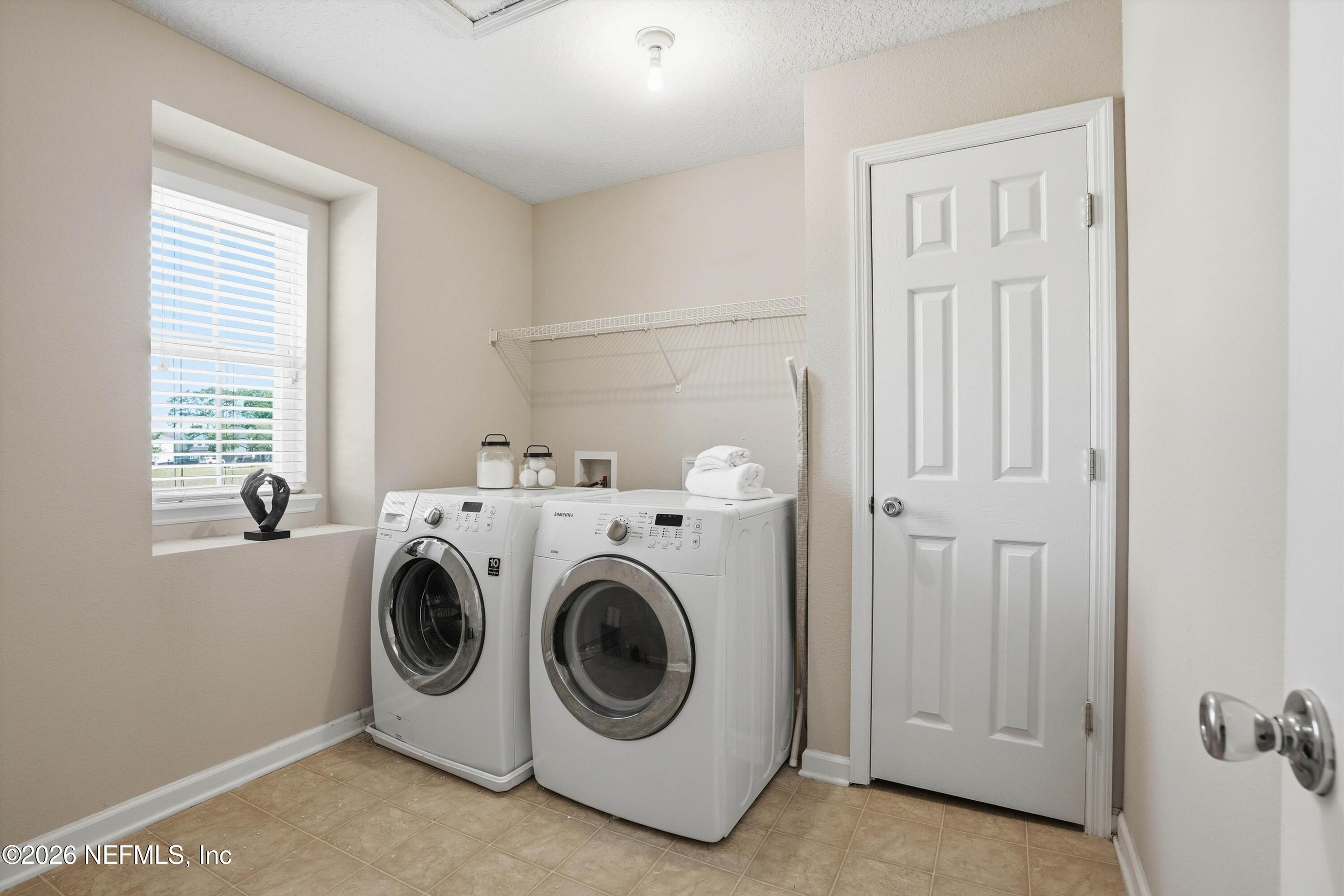 29 Auburn Oaks Road West Jacksonville, FL 32218 - Photo 26 of 38 a utility room with dryer and washer