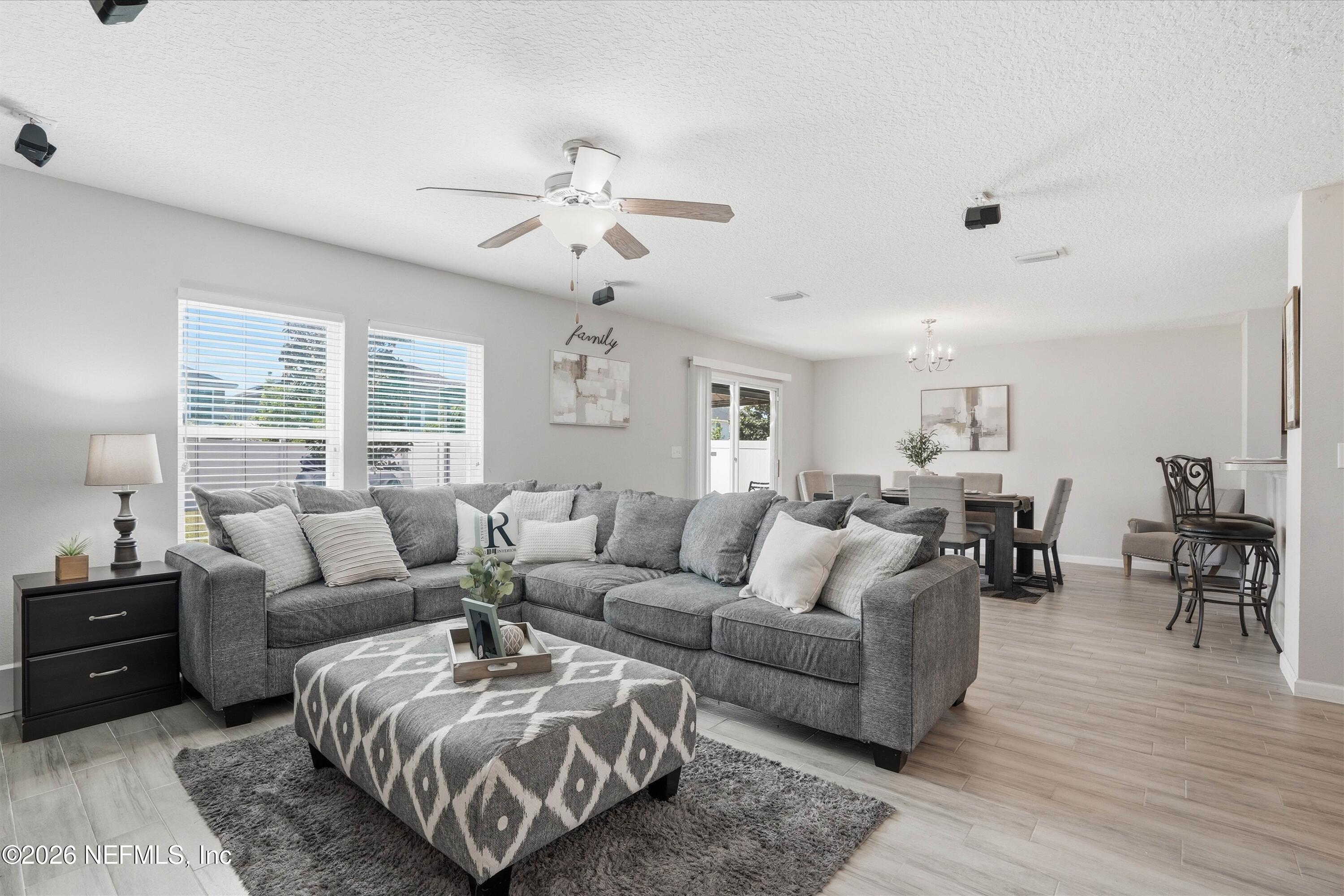 29 Auburn Oaks Road West Jacksonville, FL 32218 - Photo 3 of 38 a living room with furniture and a large window