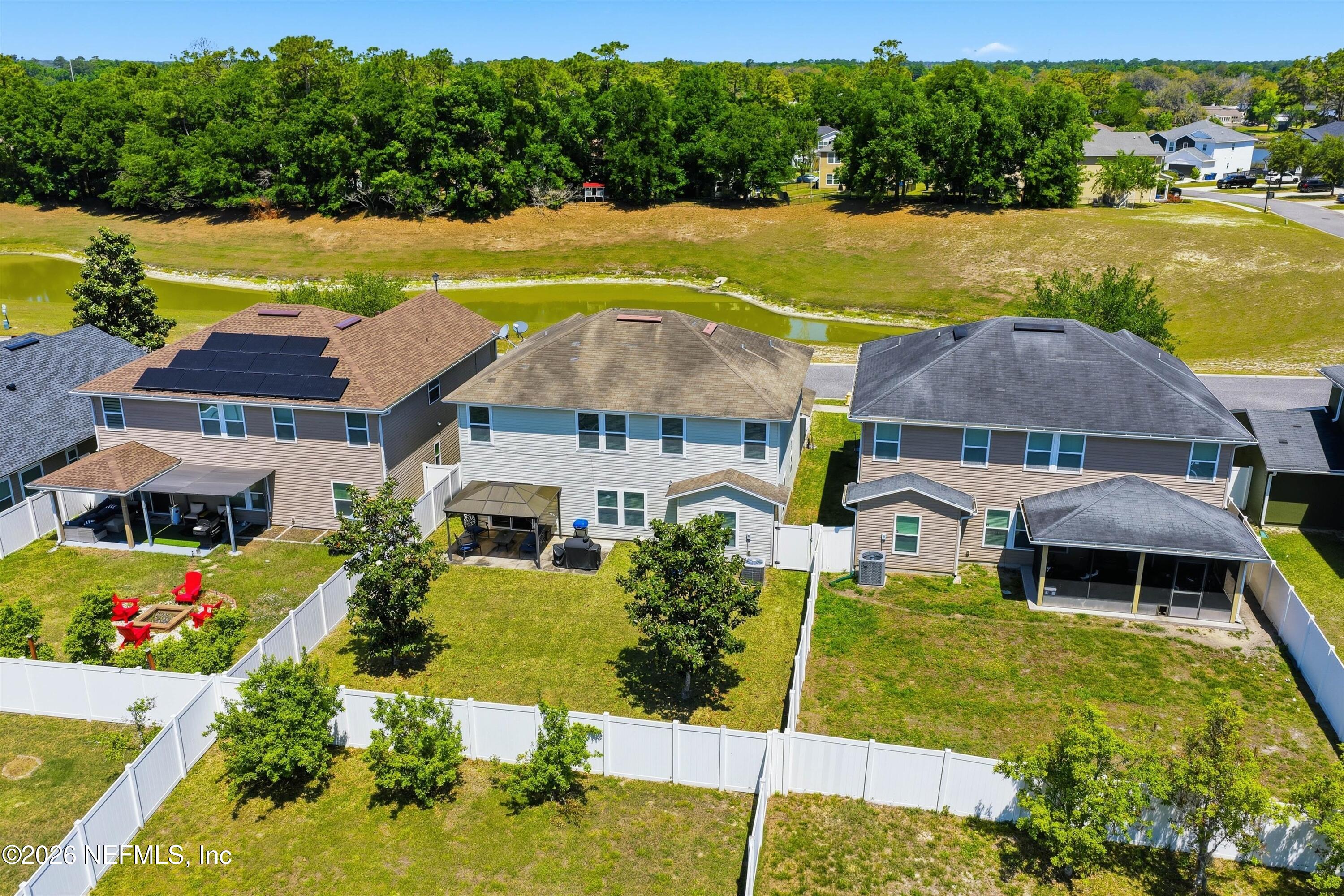 29 Auburn Oaks Road West Jacksonville, FL 32218 - Photo 34 of 38 an aerial view of a house with pool and ocean view