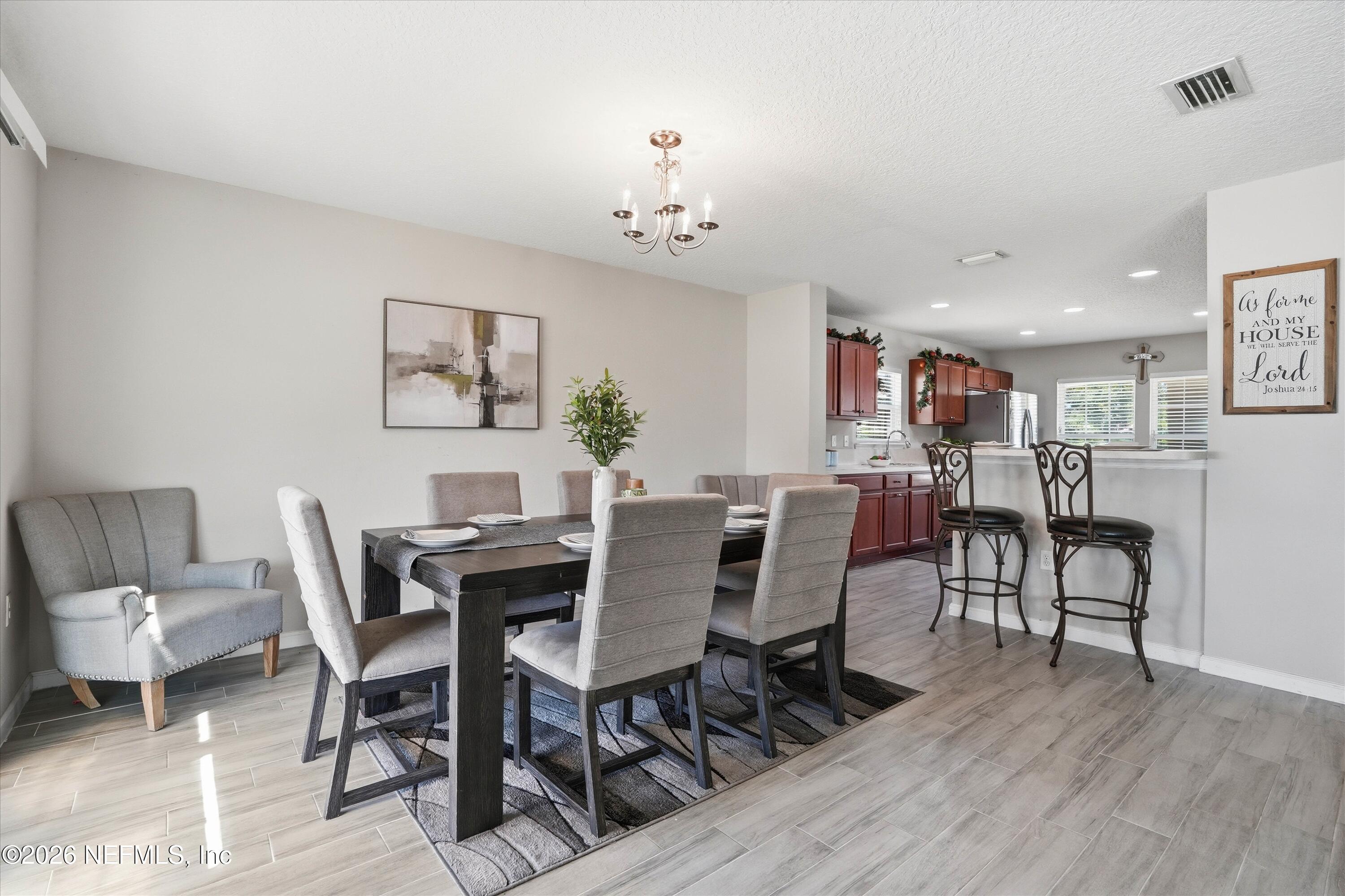 29 Auburn Oaks Road West Jacksonville, FL 32218 - Photo 6 of 38 a view of a dining room with furniture and wooden floor
