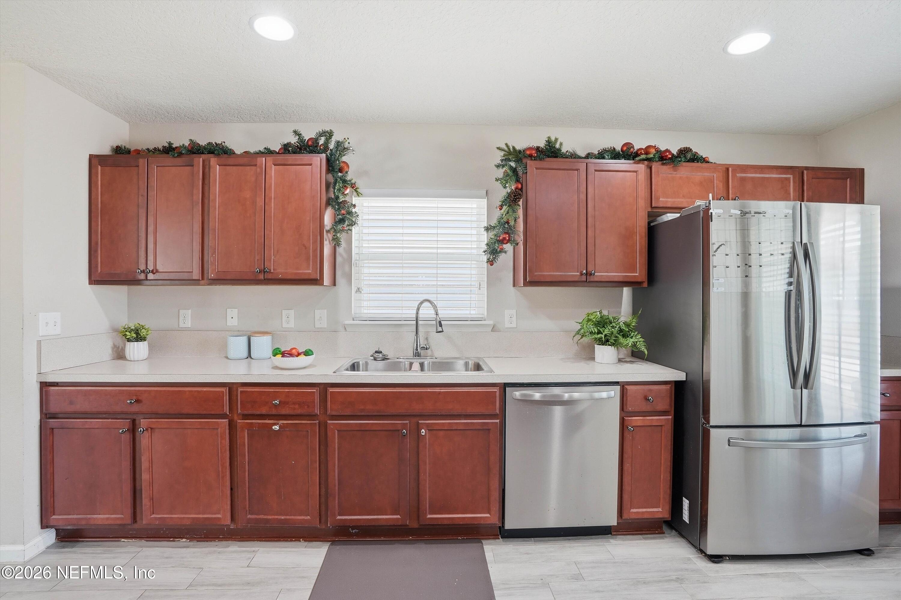 29 Auburn Oaks Road West Jacksonville, FL 32218 - Photo 10 of 38 a kitchen with stainless steel appliances a refrigerator and a sink