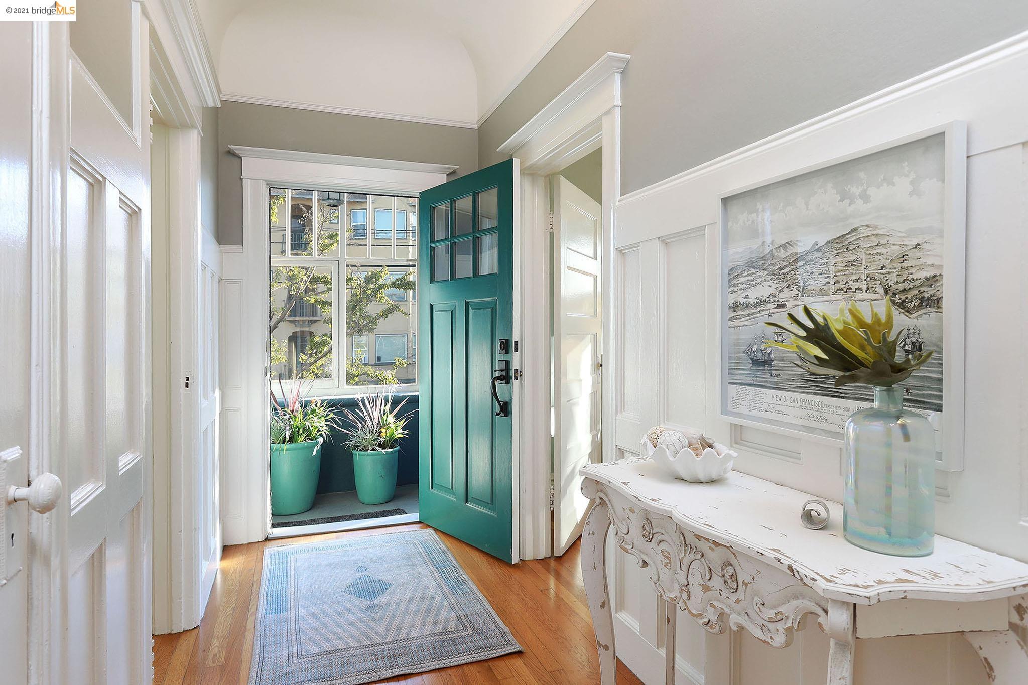 a spacious bathroom with a granite countertop sink a mirror a bathtub and next to a window