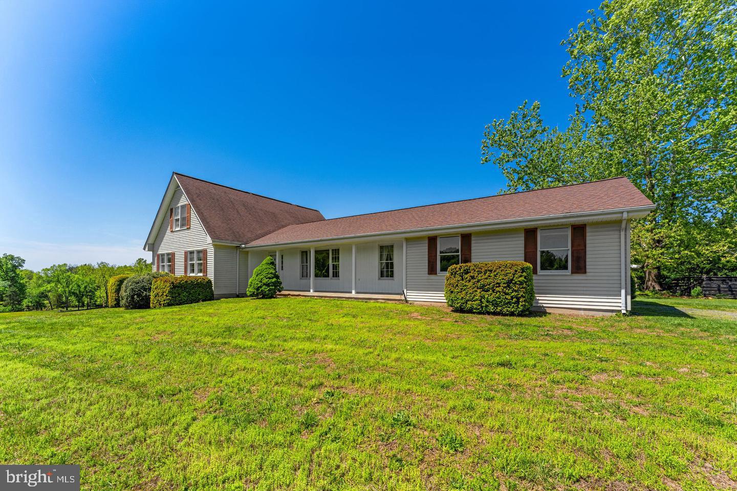 40297 Braddock Road Aldie, VA 20105 - Photo 1 of 34 a view of a house with a big yard and large trees
