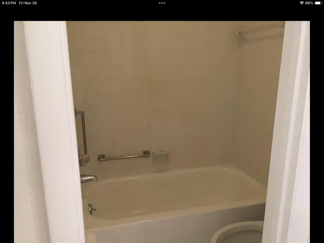 a close up of a bathtub in a bathroom