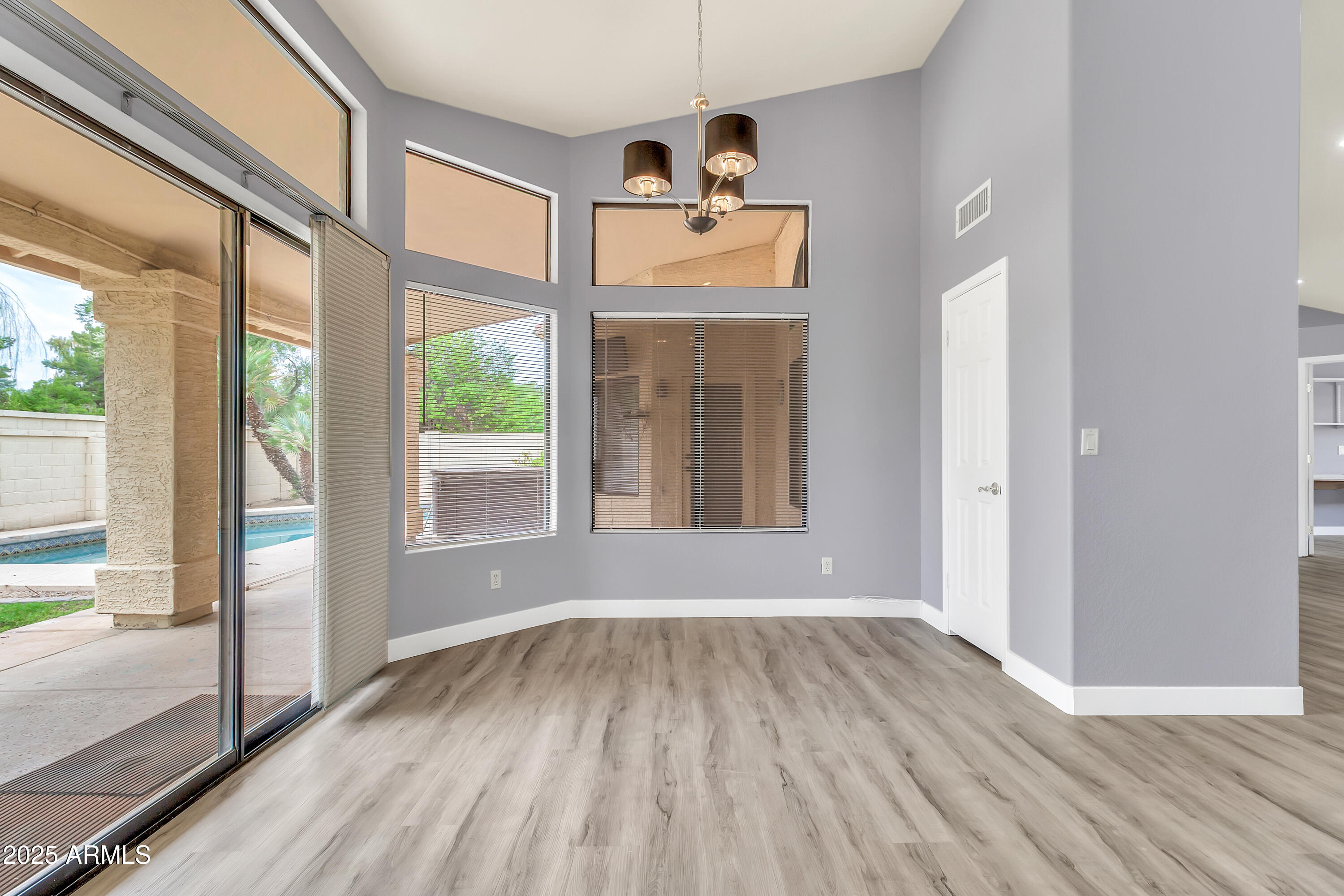 205 East Stacey Lane Tempe, AZ 85284 - Photo 14 of 63 a view of an entryway with wooden floor and windows