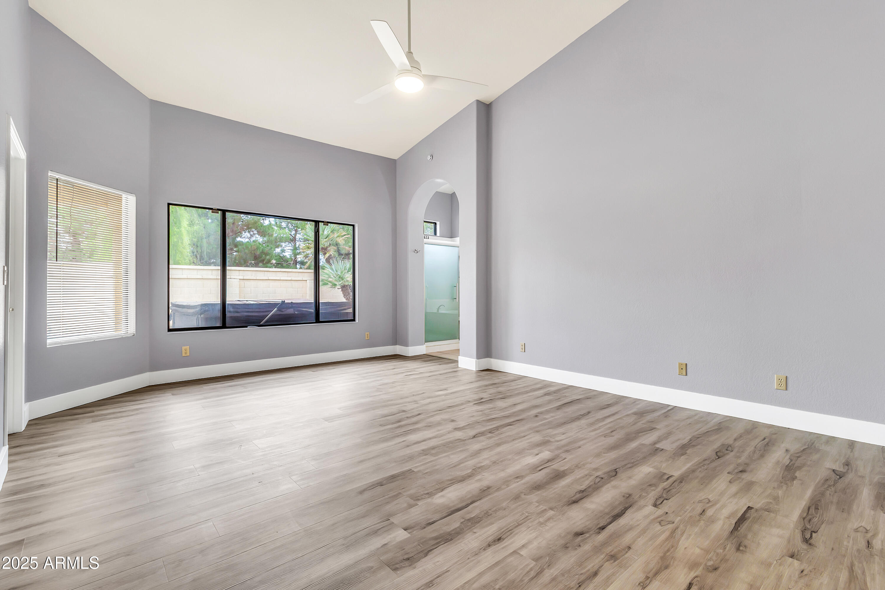 205 East Stacey Lane Tempe, AZ 85284 - Photo 18 of 63 a view of an empty room with wooden floor and a window