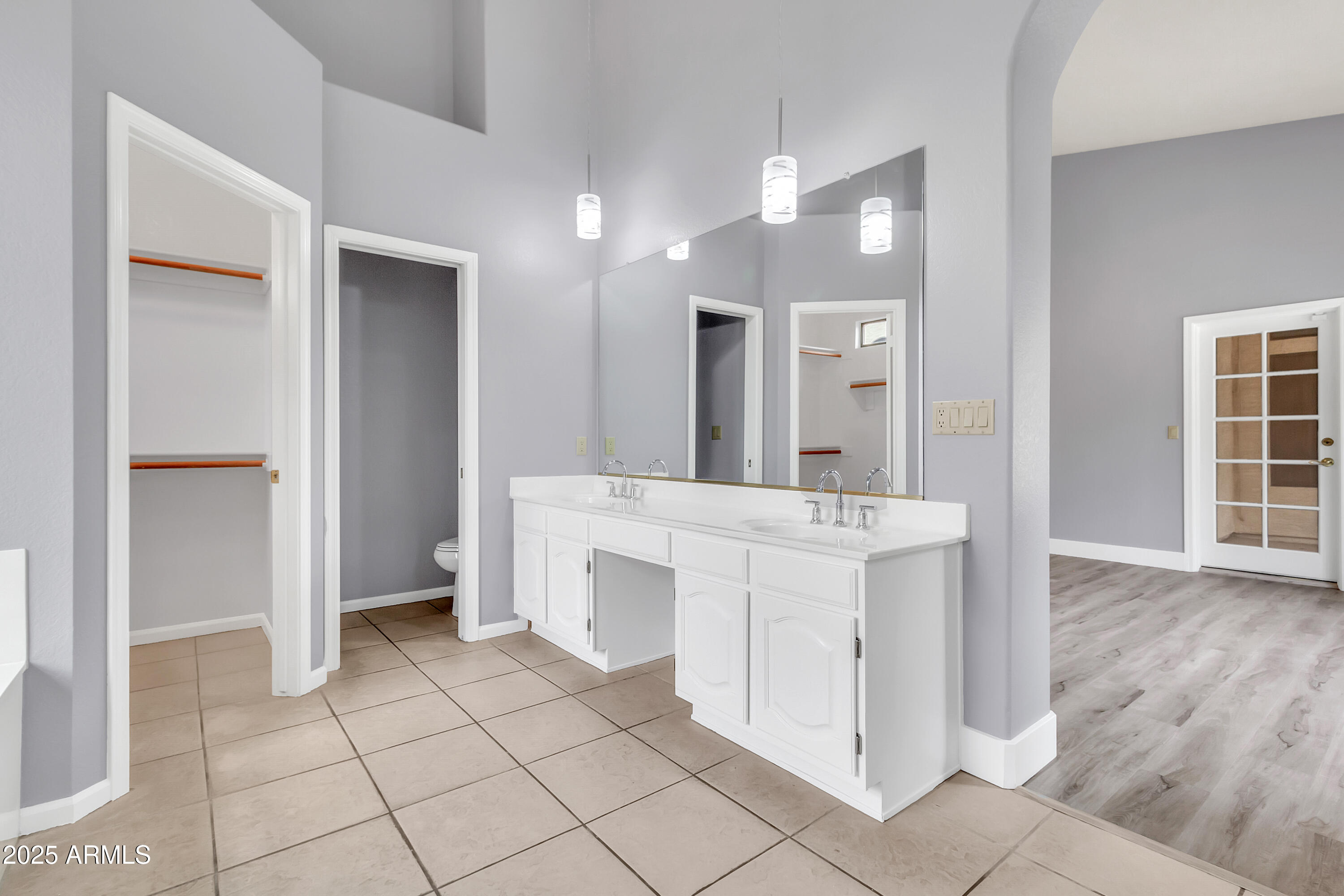 205 East Stacey Lane Tempe, AZ 85284 - Photo 20 of 63 a bathroom with a sink a mirror and a shower
